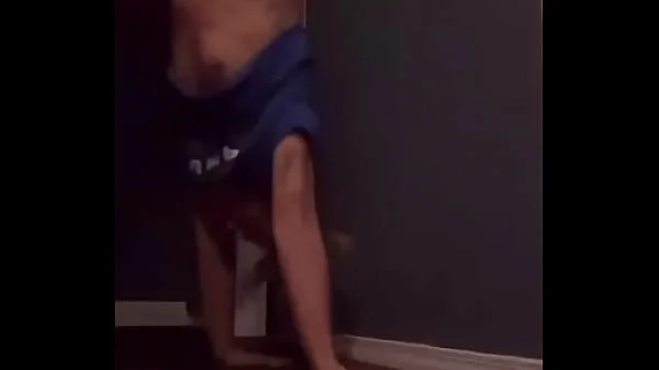 Teen doing a handstand with nip slip